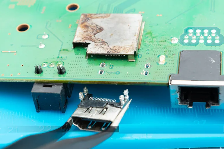 Take Out The HDMI Port Using A Tweezer