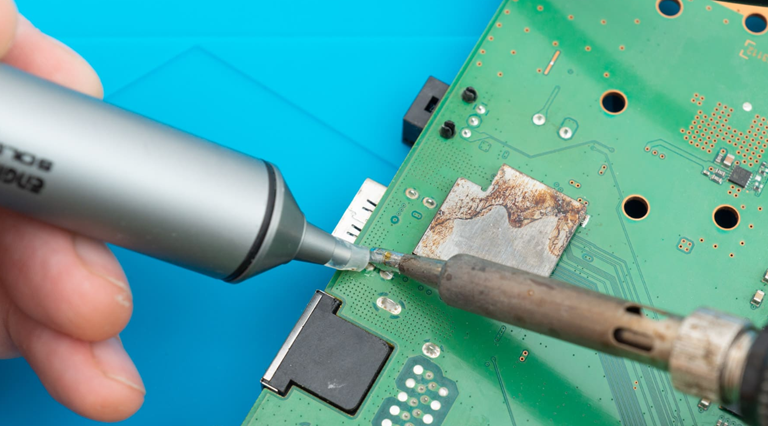 Use Desoldering Pump And Soldering Iron To Remove Flux