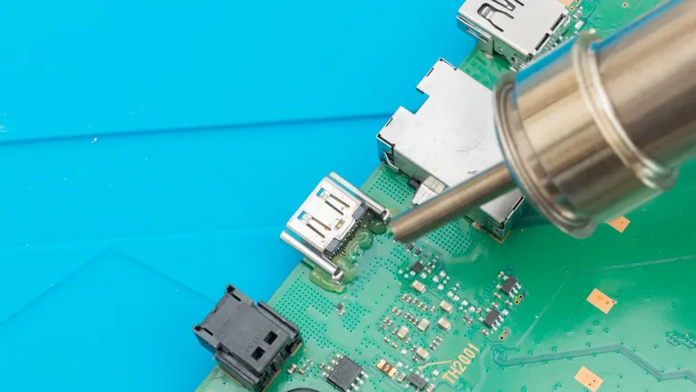 Use The Hot Gun To Melt The Solder