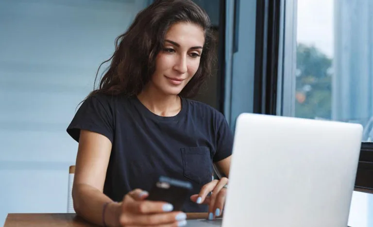 Girl Using Laptop and Phone Girl Using Laptop and Phone