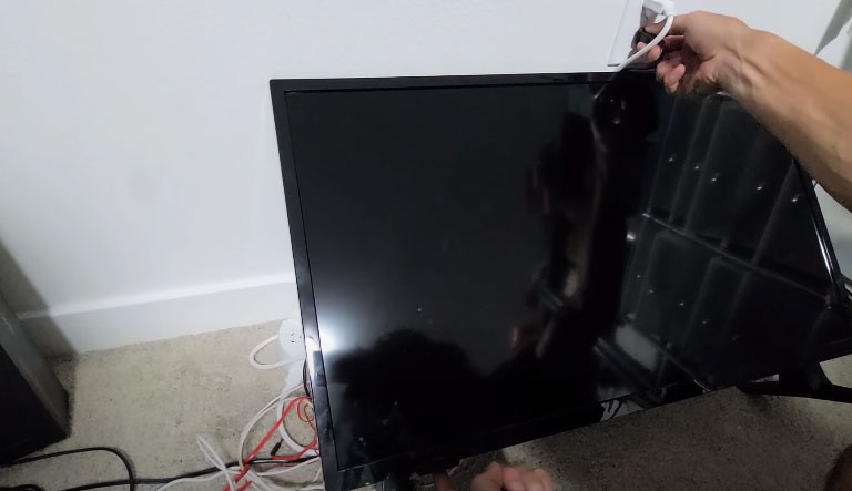Plug In Your Tv While Holding The Power Button